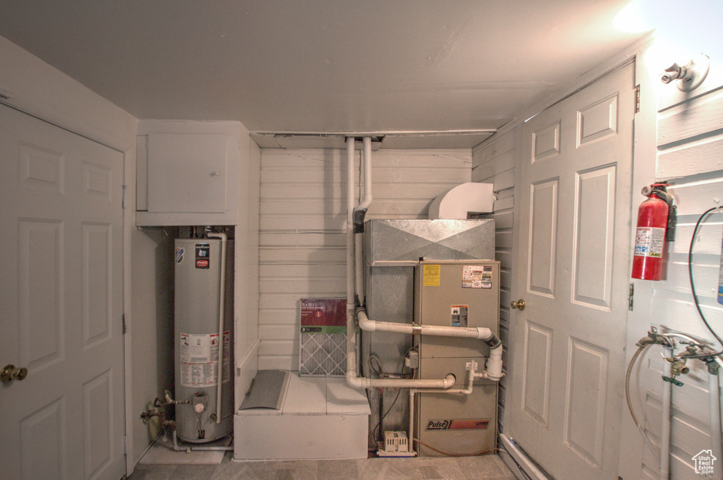 Utility room with heating utilities and gas water heater