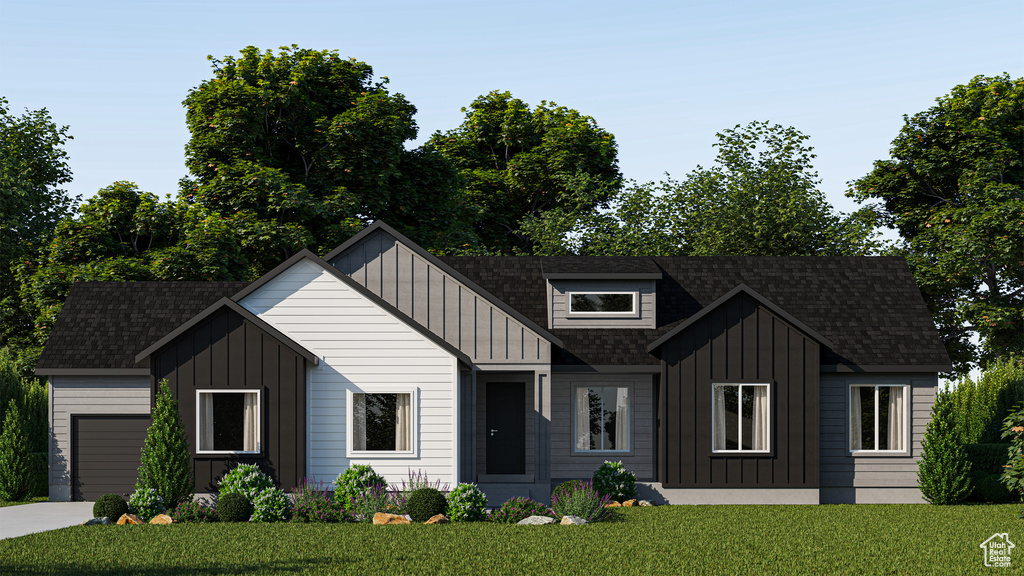 Modern farmhouse with a garage and a front yard