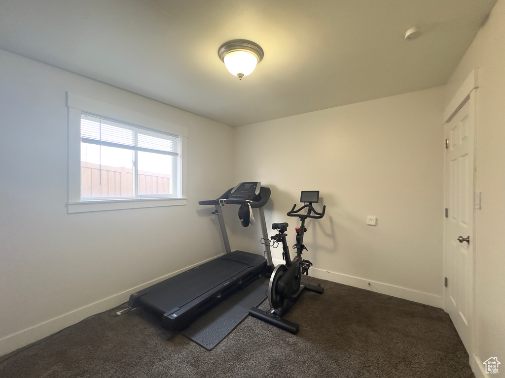 Exercise room with dark colored carpet