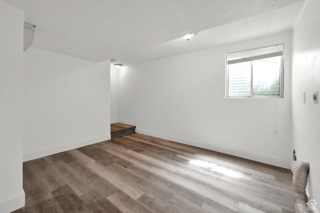 Unfurnished room featuring hardwood / wood-style flooring