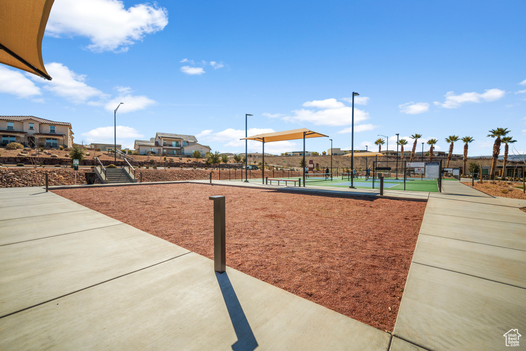 View of home\\\\\\\'s community featuring tennis court