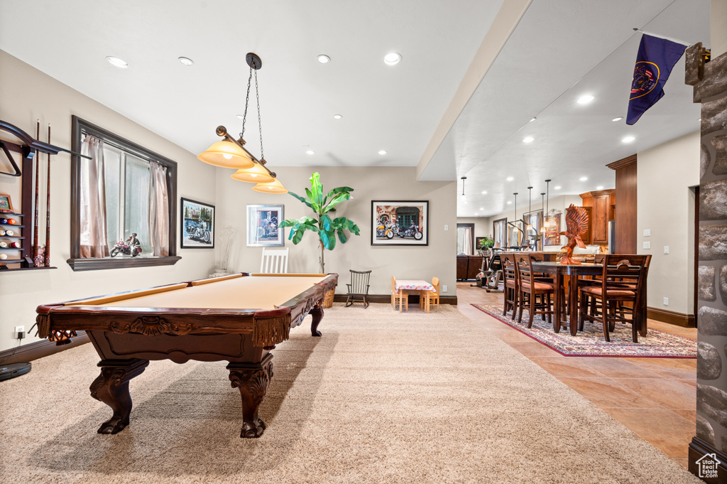 Recreation room with pool table and light tile flooring