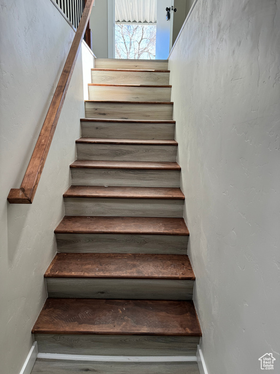 Stairway with hardwood / wood-style floors