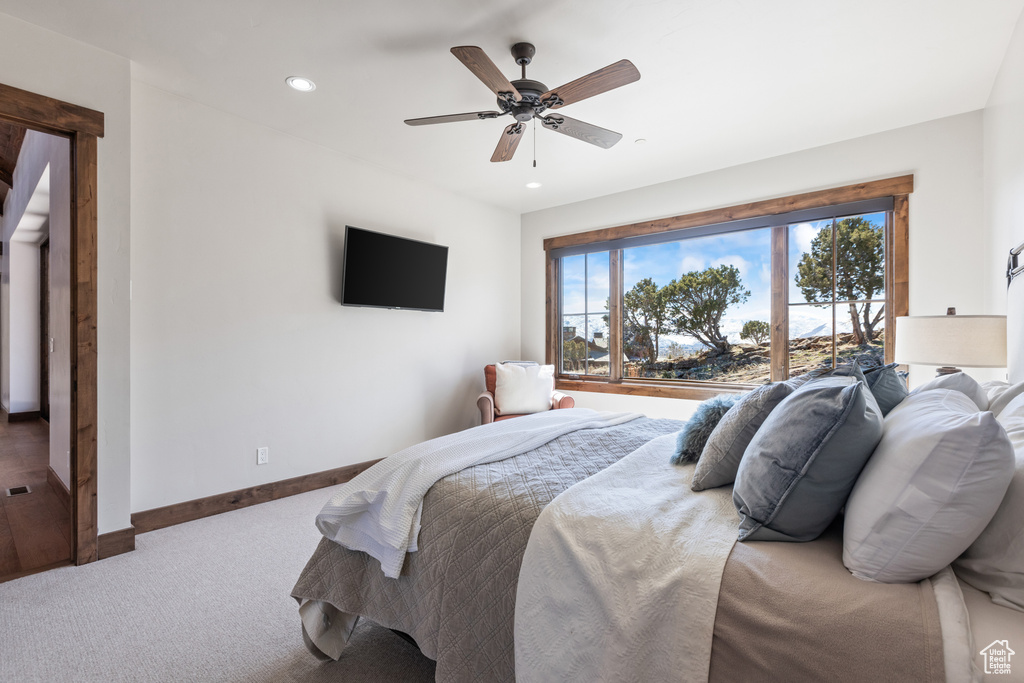 Bedroom featuring carpet and ceiling fan