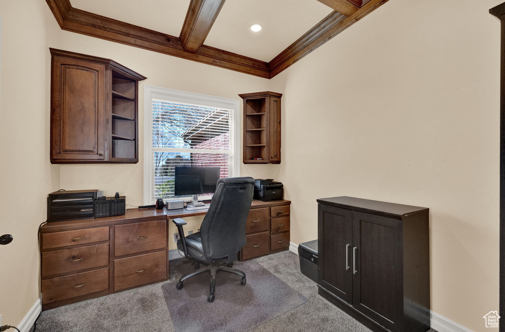 Office featuring beam ceiling and light carpet
