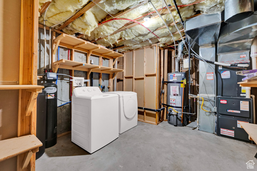 Basement with secured water heater and washer and clothes dryer
