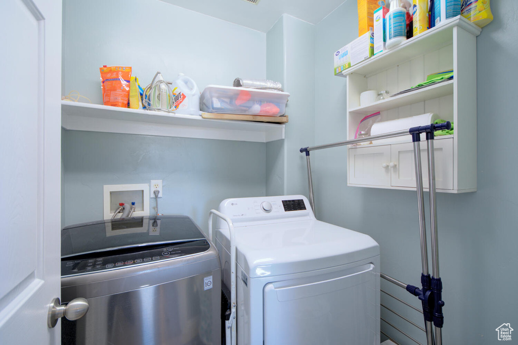 Laundry room featuring washer and dryer and washer hookup