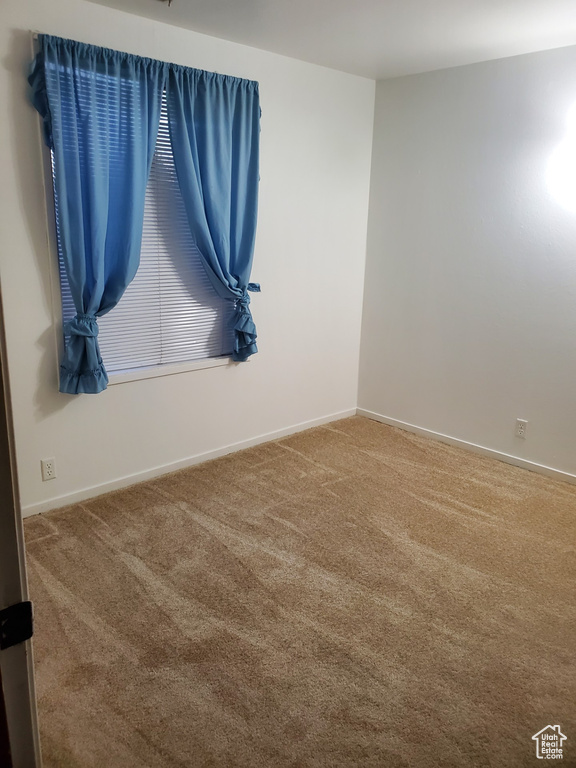 Empty room with carpet floors
