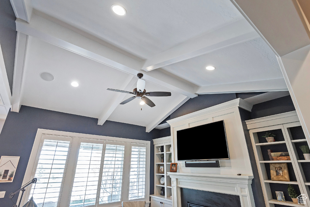 Interior space featuring beamed ceiling and ceiling fan