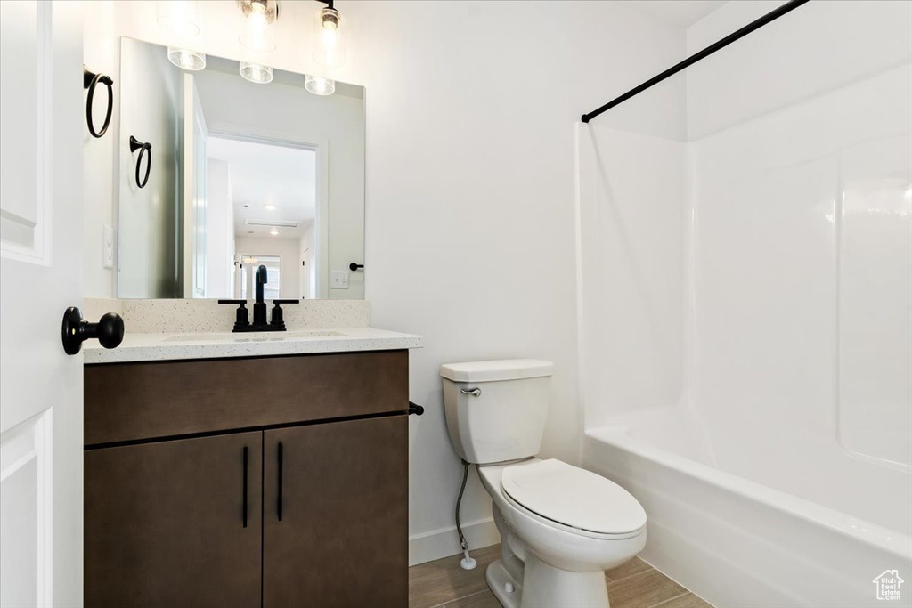 Full bathroom with toilet, shower / washtub combination, and oversized vanity