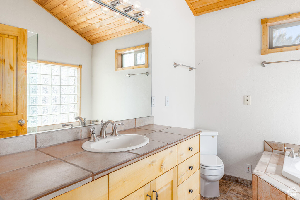 Bathroom with lofted ceiling, toilet, tile flooring, and wood ceiling