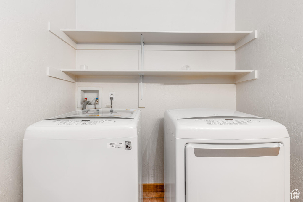 Washroom with separate washer and dryer and washer hookup
