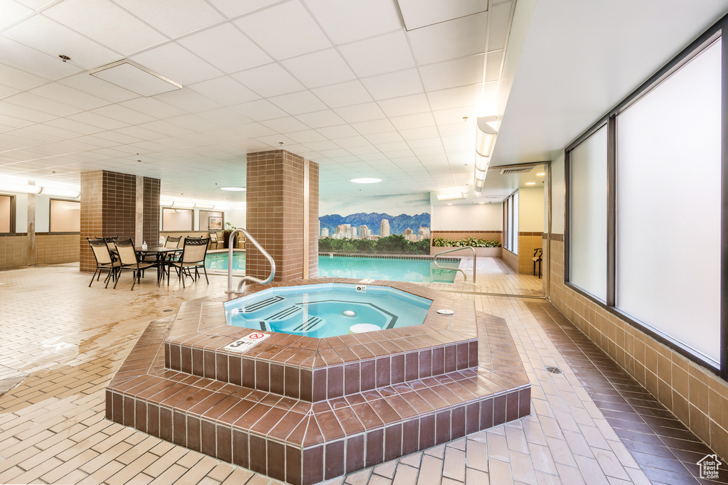 View of swimming pool featuring an indoor in ground hot tub