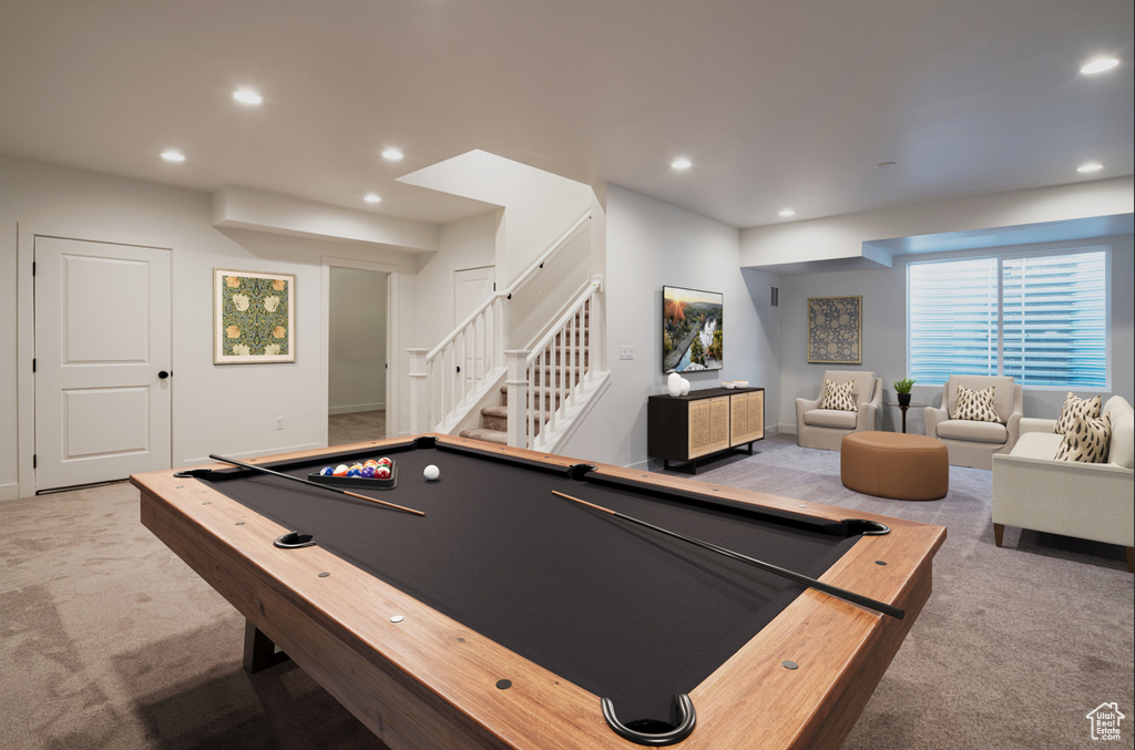 Game room with light carpet and pool table