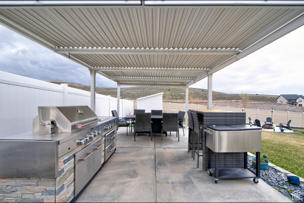 View of patio / terrace featuring an outdoor kitchen and grilling area