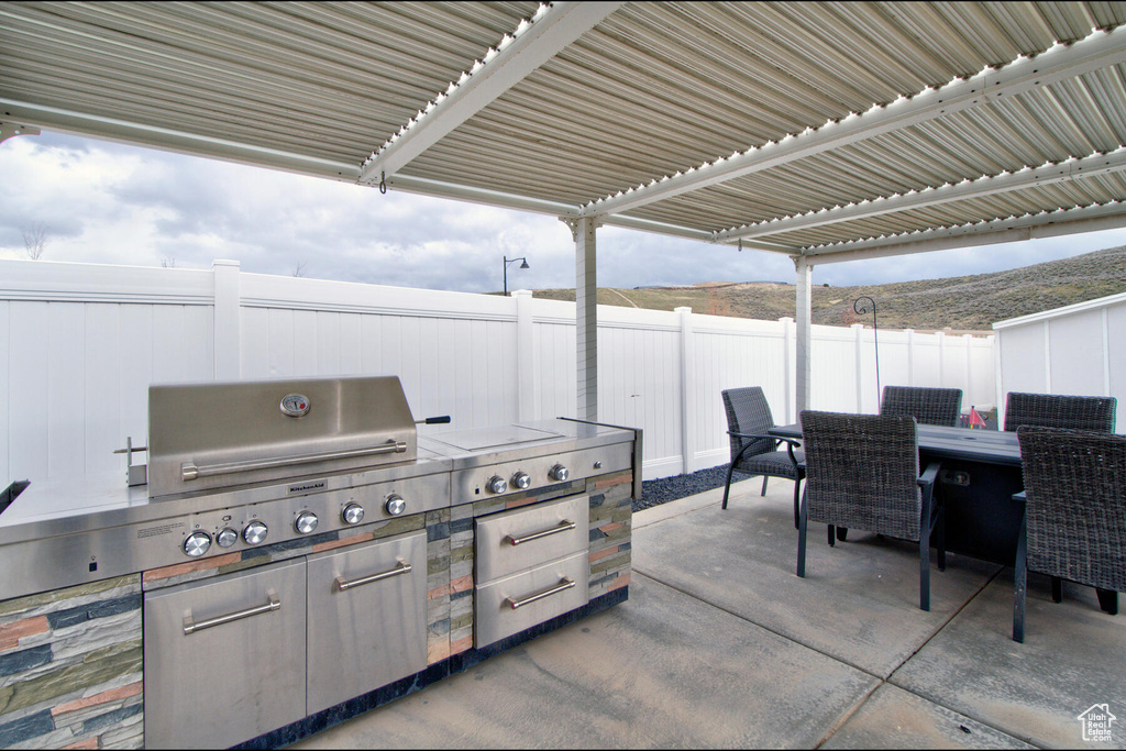 View of patio / terrace featuring a pergola and area for grilling