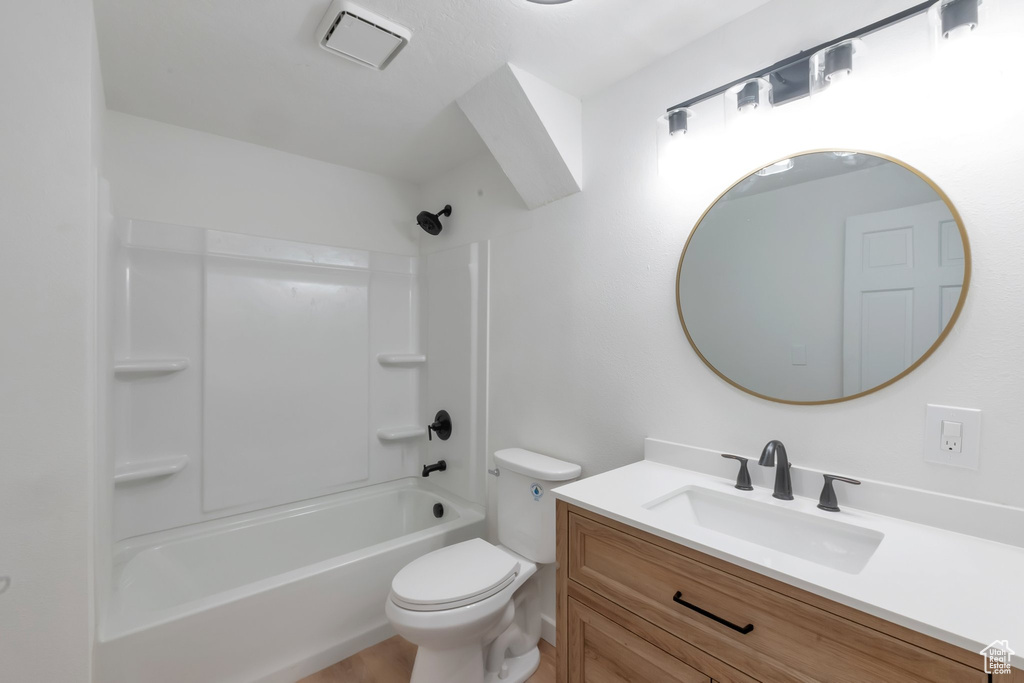 Full bathroom featuring shower / tub combination, toilet, and oversized vanity