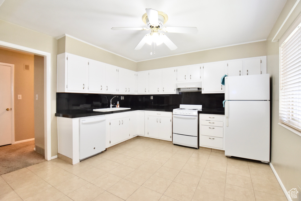 Kitchen featuring tasteful backsplash, ceiling fan, white appliances, and light tile floors