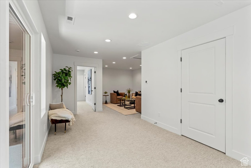 Sitting room with light colored carpet