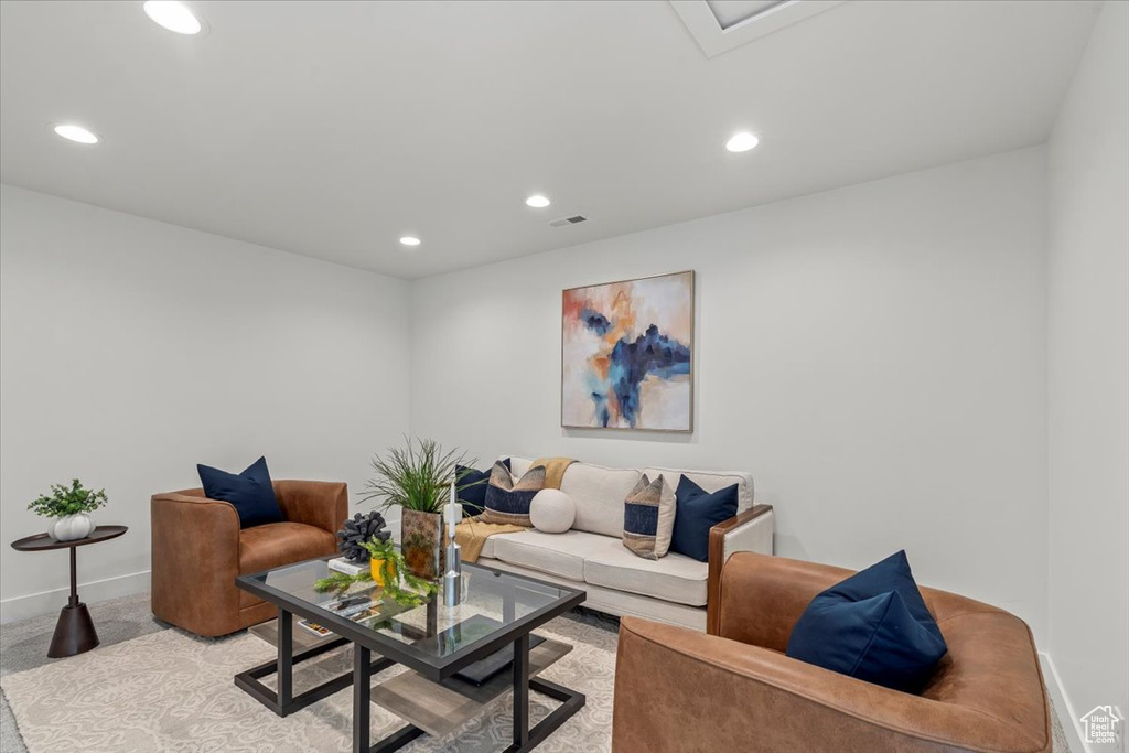 Living room featuring light colored carpet