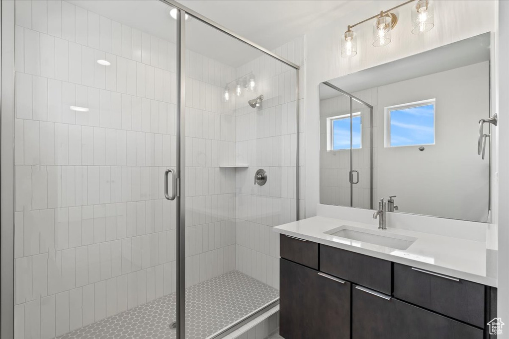 Bathroom with vanity and an enclosed shower