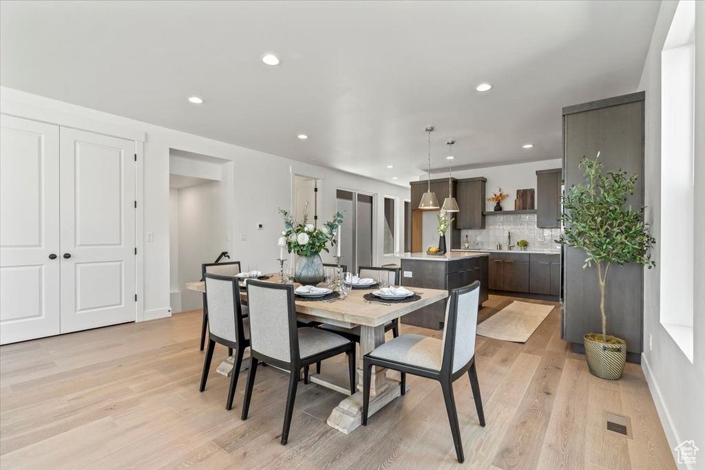 Dining room featuring light hardwood / wood-style floors and sink