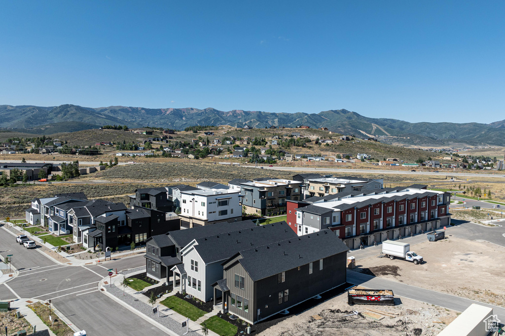 Birds eye view of property with a mountain view