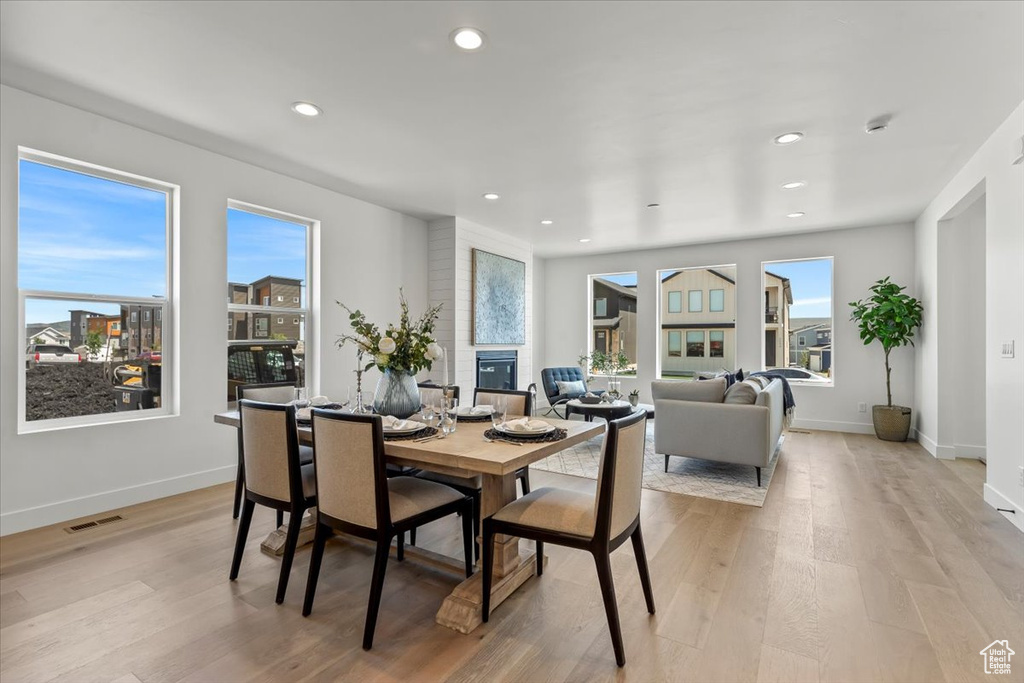 Dining space featuring a wealth of natural light and light wood-type flooring