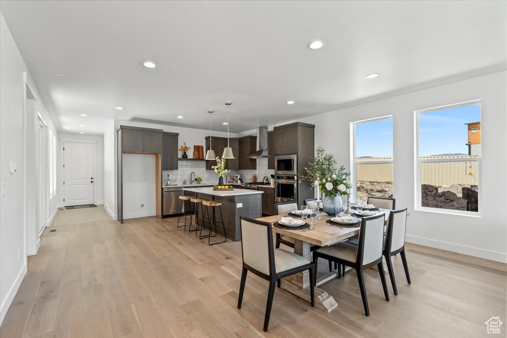 Dining area featuring light hardwood / wood-style floors and sink