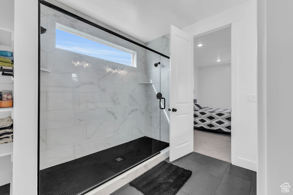 Bathroom with tile flooring and walk in shower