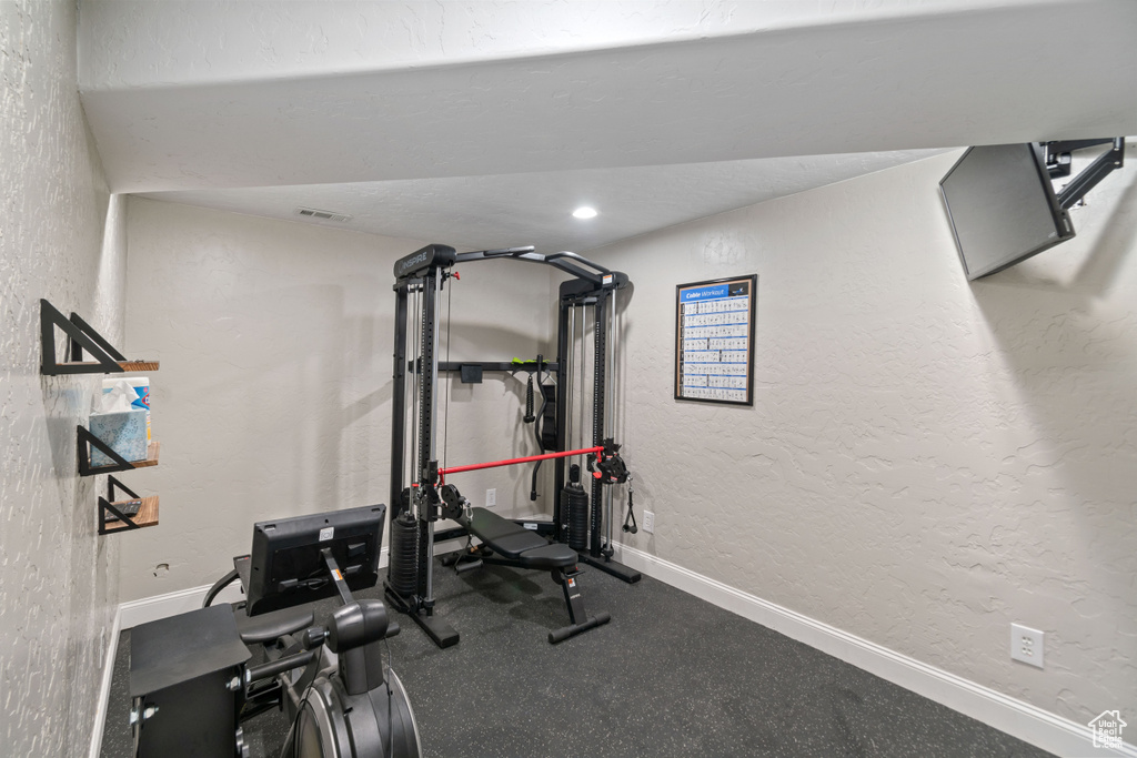 Workout area featuring lofted ceiling