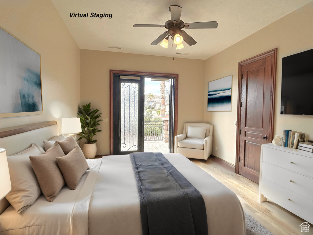 Bedroom featuring light hardwood / wood-style flooring, ceiling fan, and access to outside