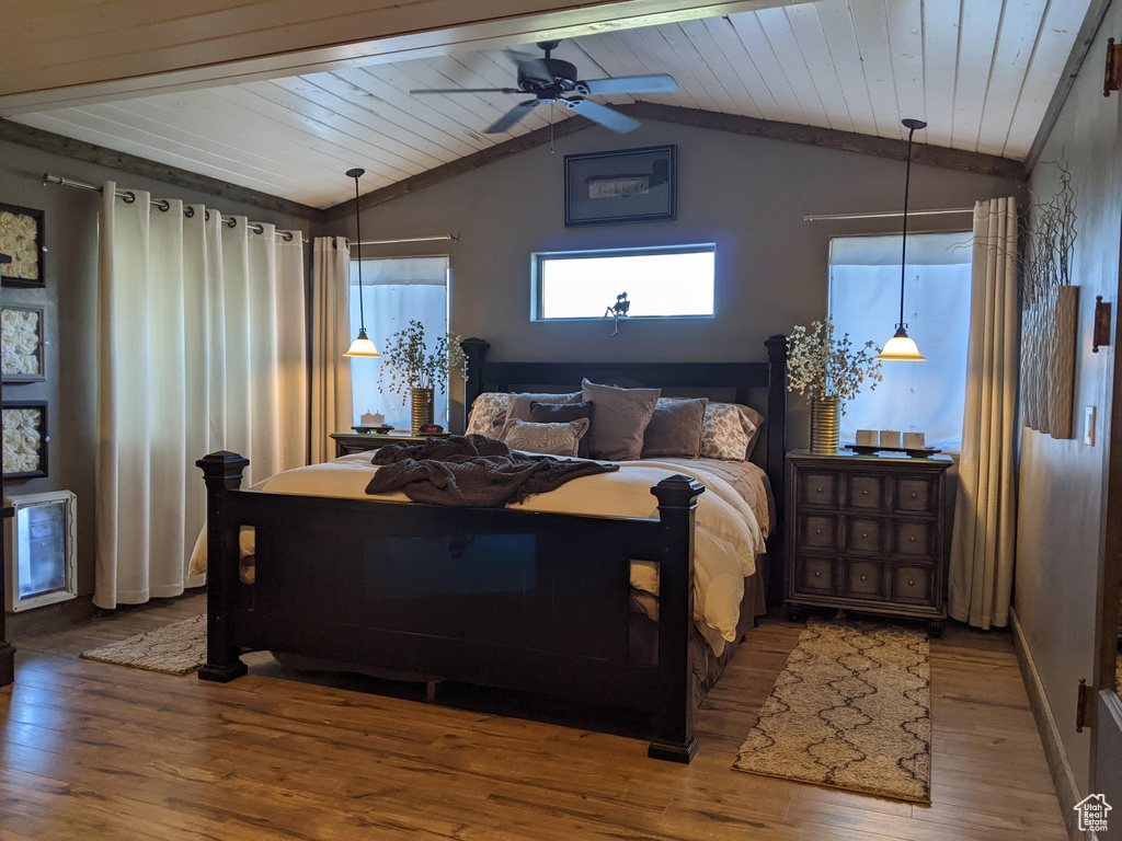 Bedroom featuring wooden ceiling, lofted ceiling, hardwood / wood-style floors, and ceiling fan