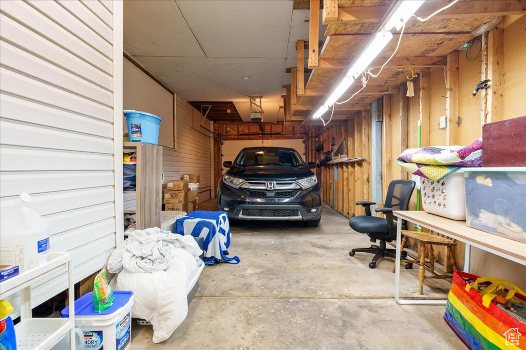 Garage featuring wooden walls