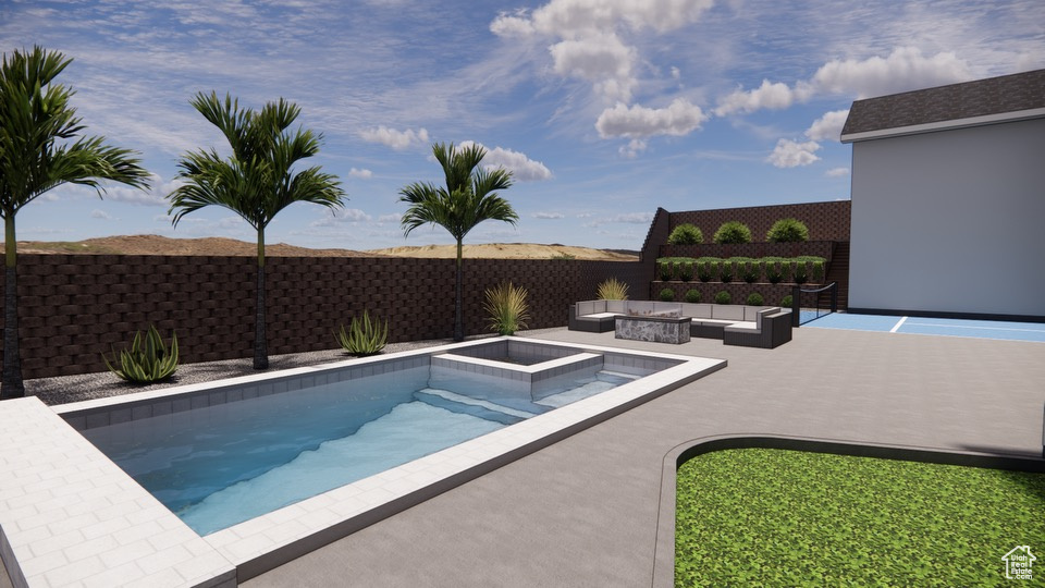 View of swimming pool featuring a patio area and an outdoor living space with a fire pit