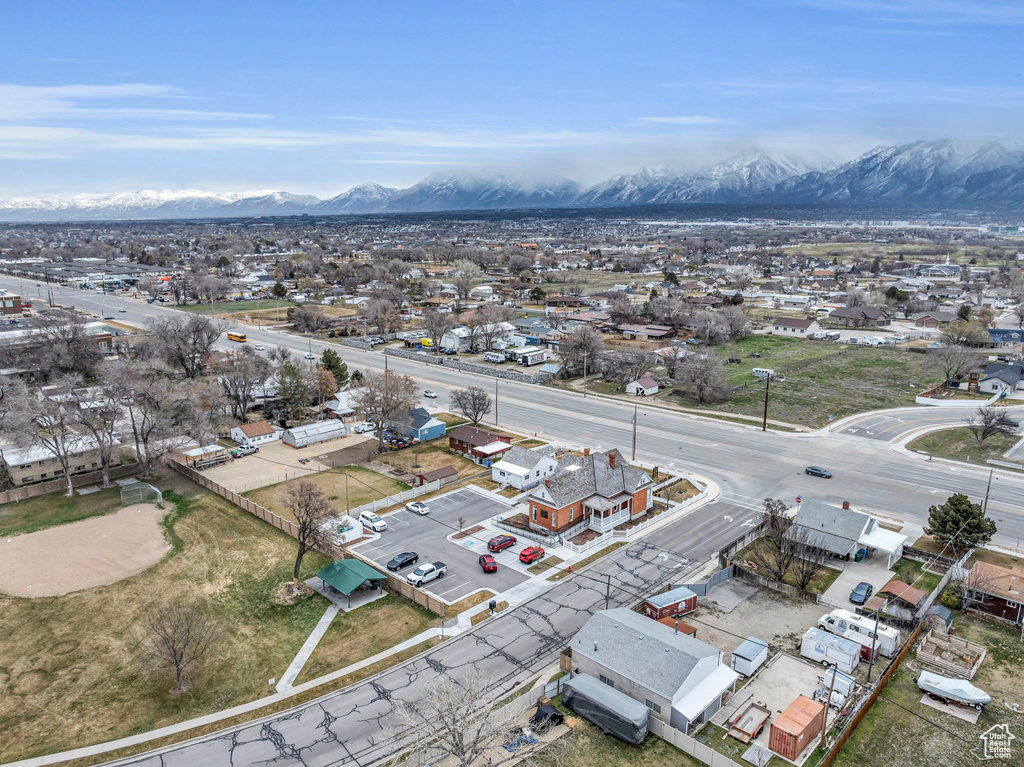 Birds eye view of property with a mountain view