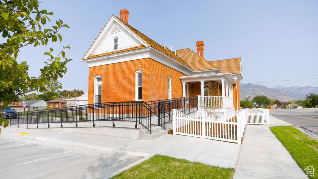 View of front of house with a mountain view