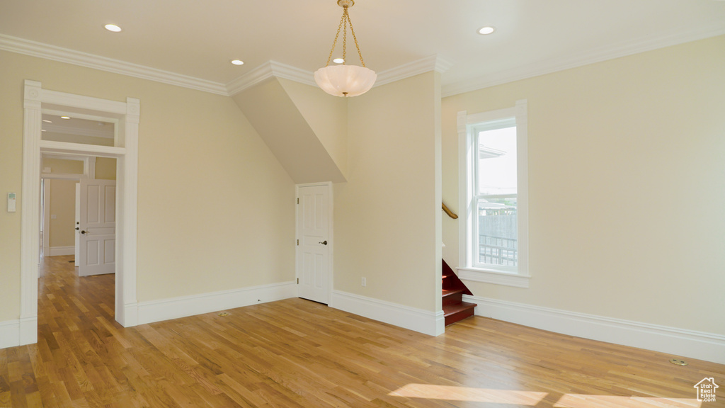 Unfurnished room featuring light hardwood / wood-style flooring and ornamental molding