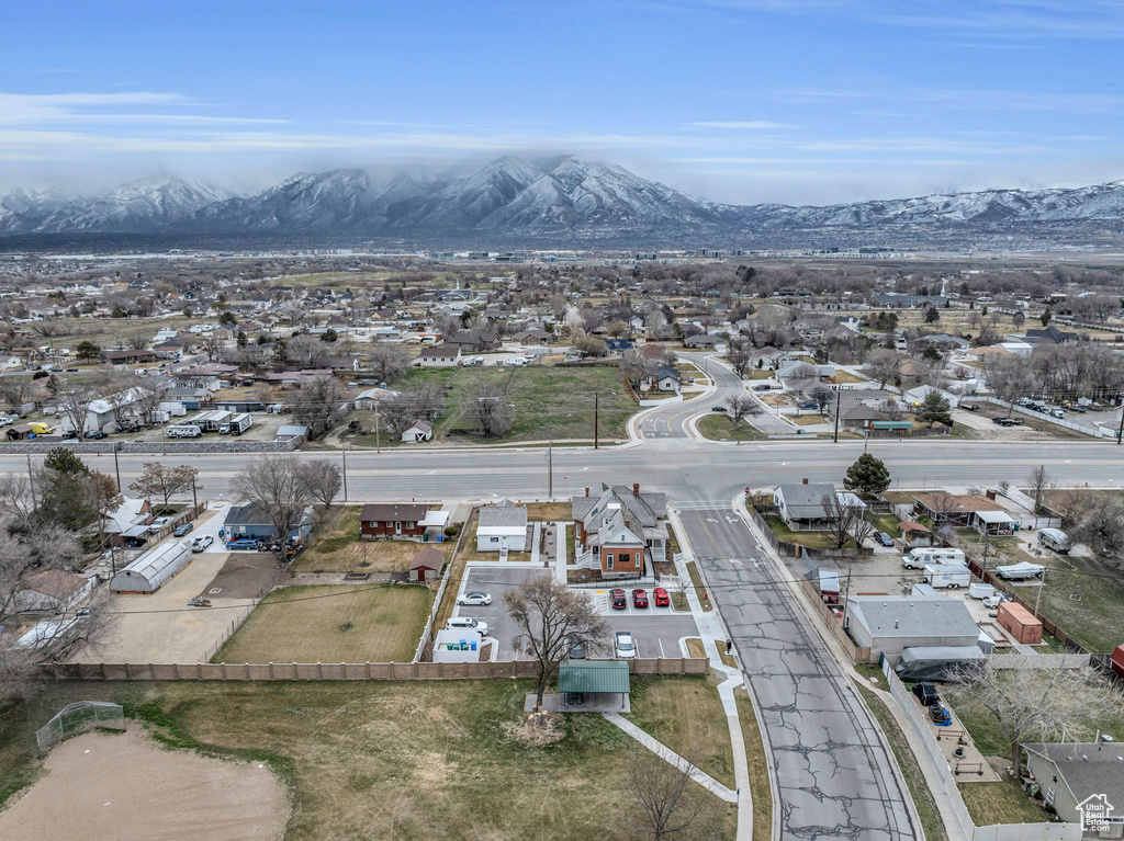 Birds eye view of property with a mountain view