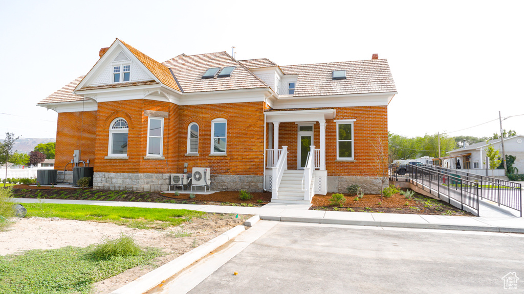 View of front of house with central AC unit