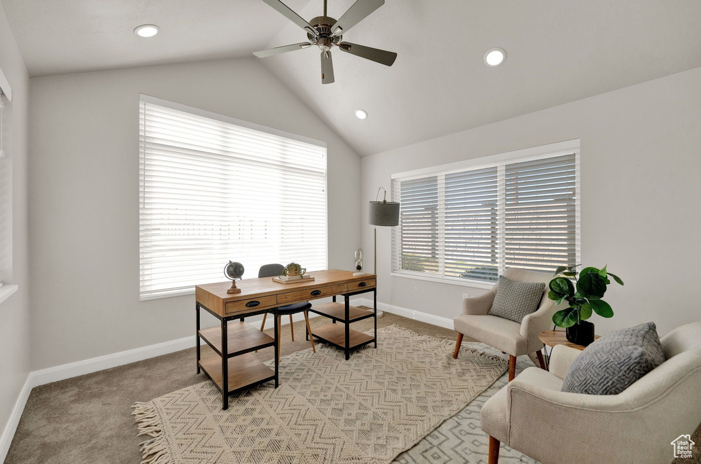 Office featuring light colored carpet, lofted ceiling, and ceiling fan