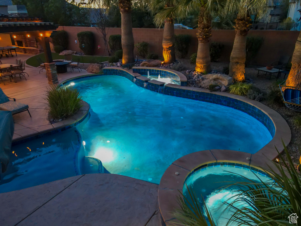 View of pool featuring an in ground hot tub and a patio