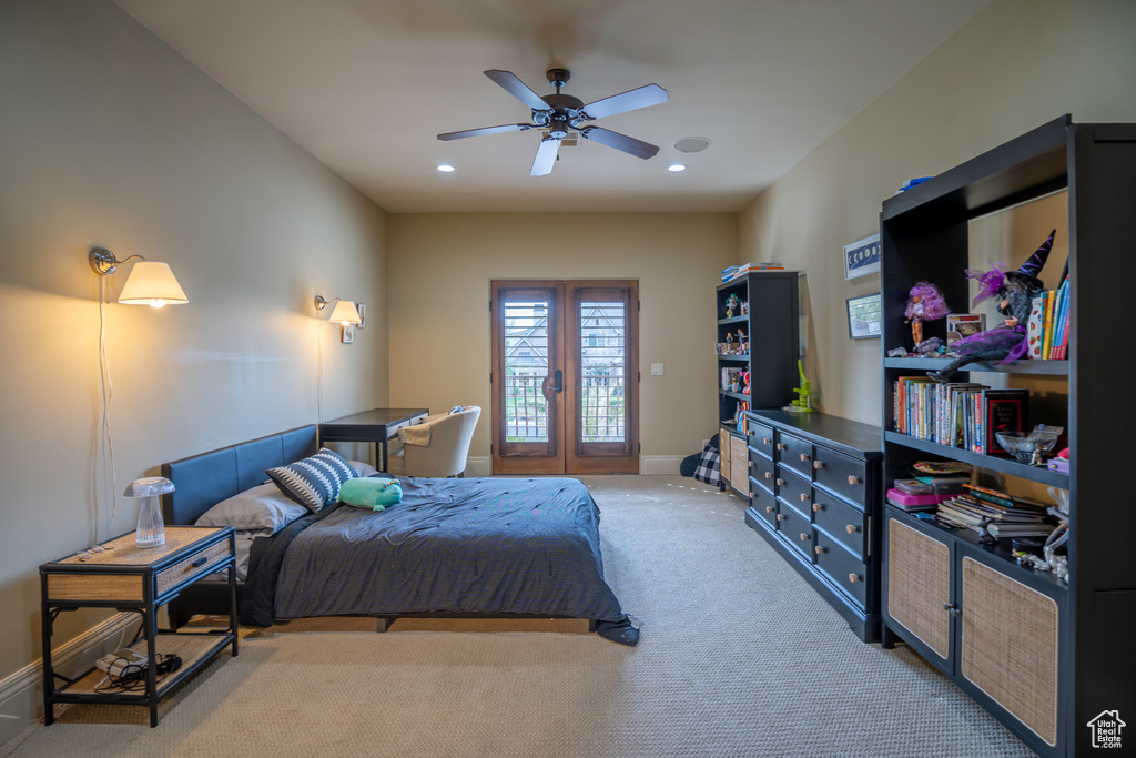 Bedroom with french doors, light carpet, access to outside, and ceiling fan