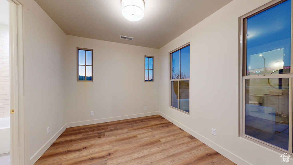 Spare room with light hardwood / wood-style floors