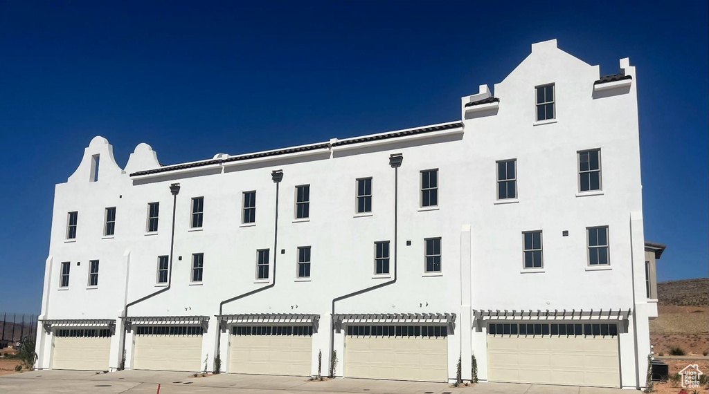 View of building exterior featuring a garage