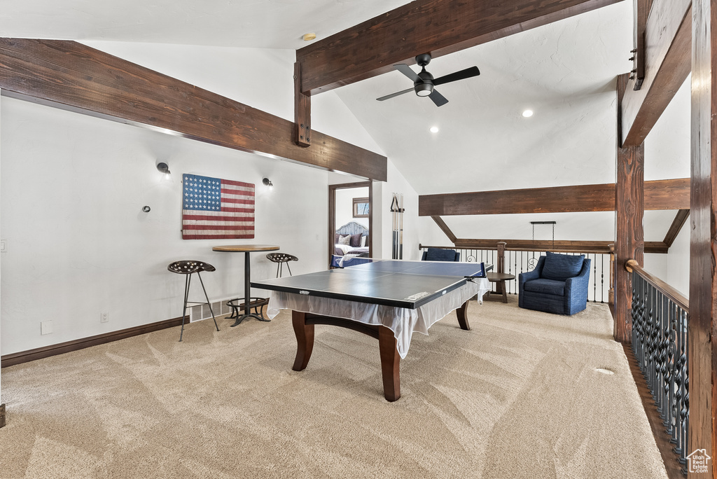 Recreation room with pool table, ceiling fan, light colored carpet, beam ceiling, and high vaulted ceiling