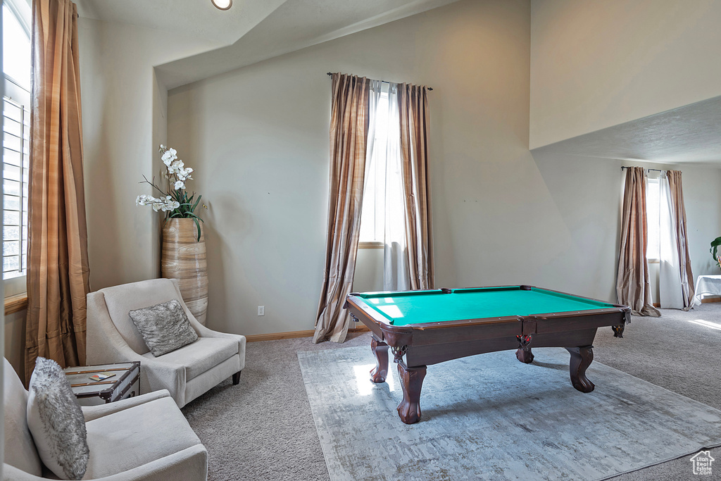 Game room with light carpet, a wealth of natural light, and pool table