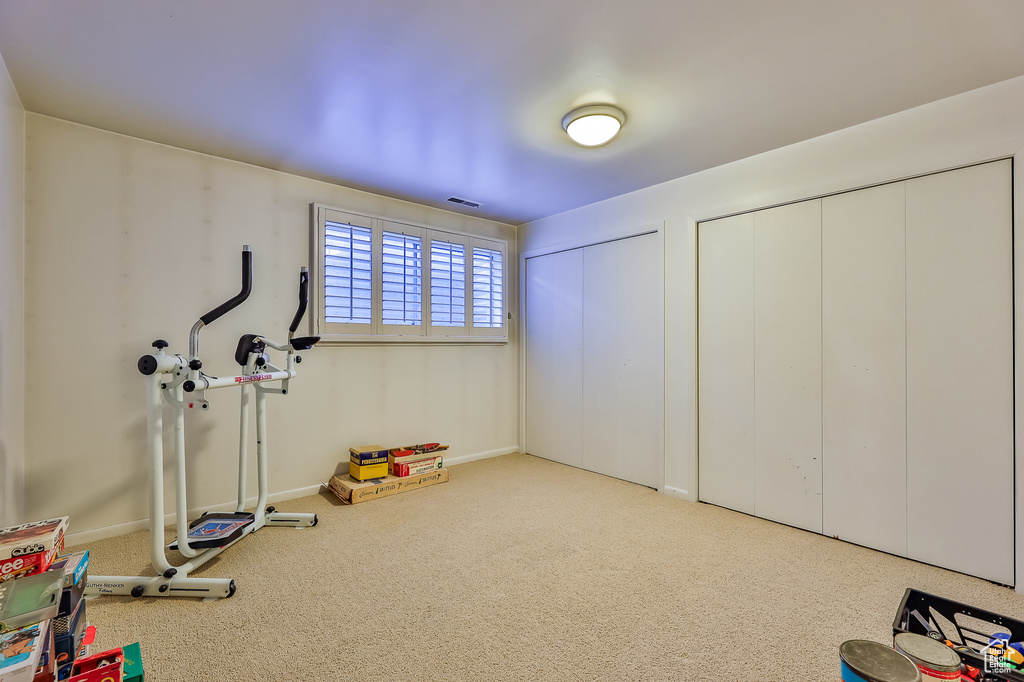 Workout room with light carpet
