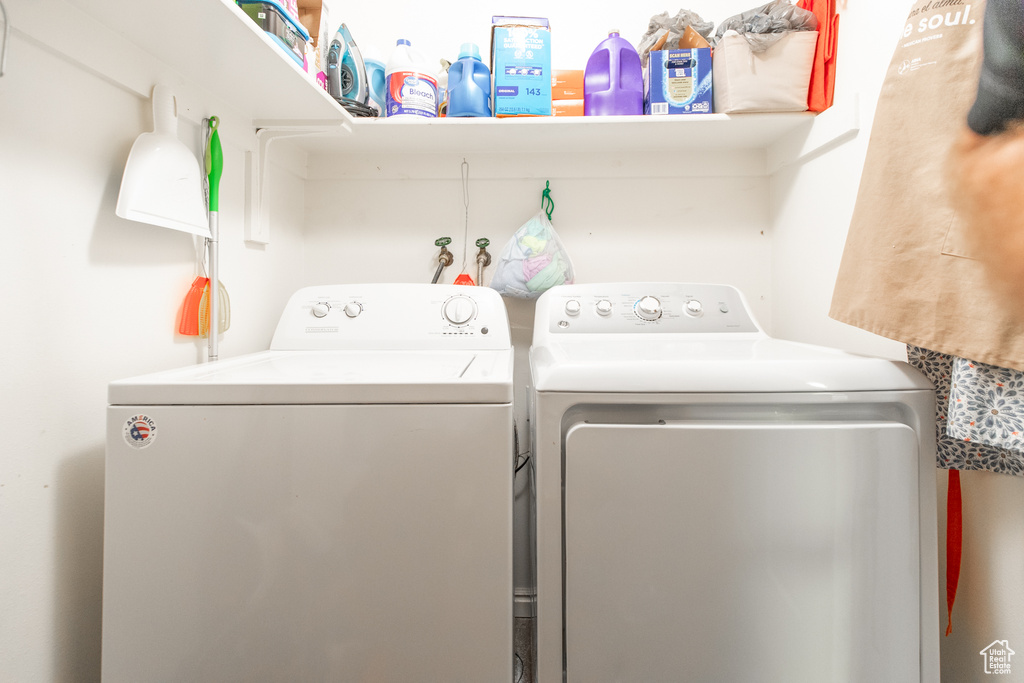 Laundry room with washing machine and clothes dryer and hookup for a washing machine