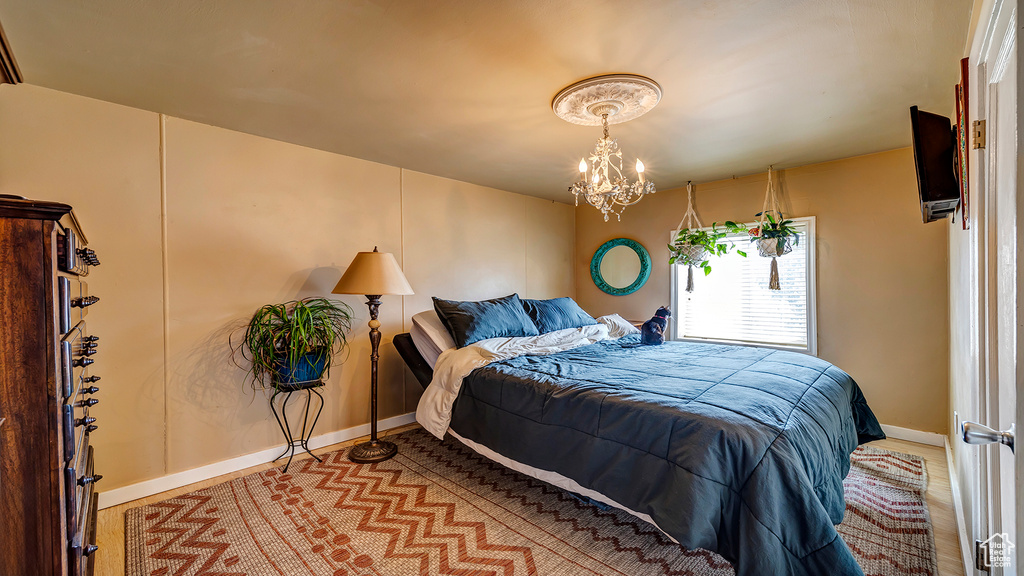 Bedroom featuring a chandelier